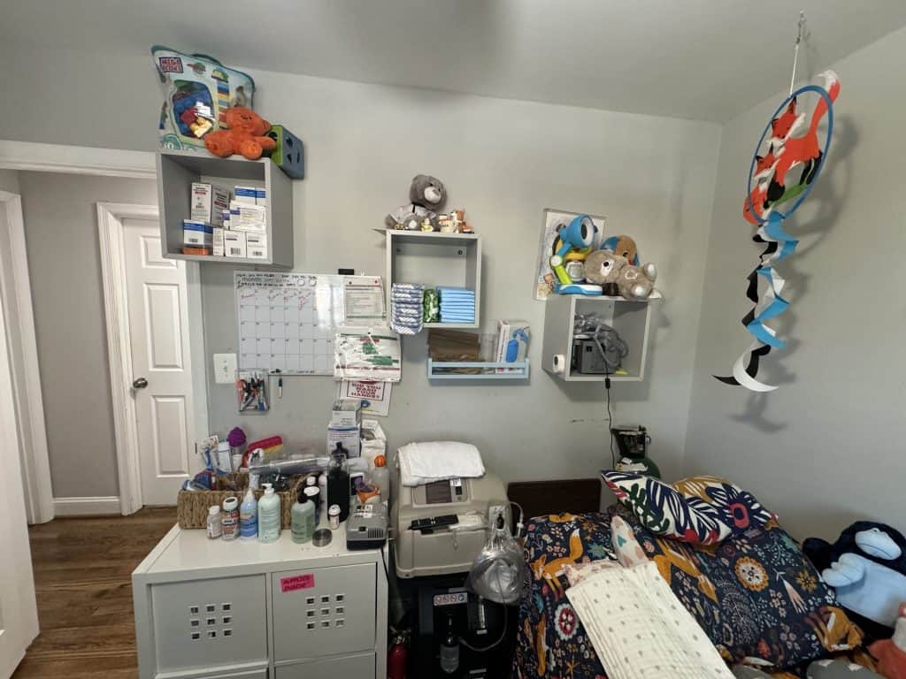 An image of Lucas bedroom showing many of his breathing related medical devices including his nebulizer, an oxygen delivery system, and his suction machine.